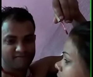 indian couple making string..